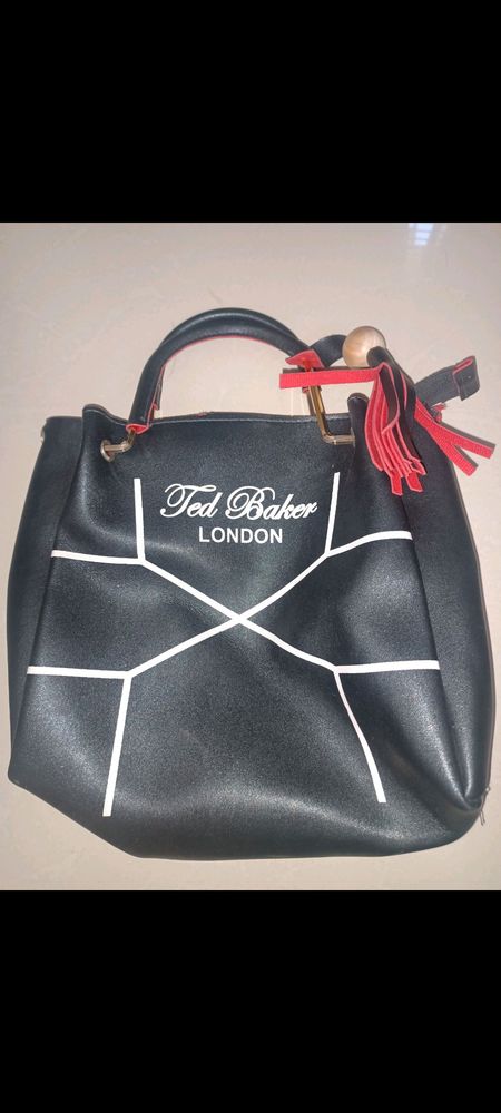 Black Ted baker london sling bag .