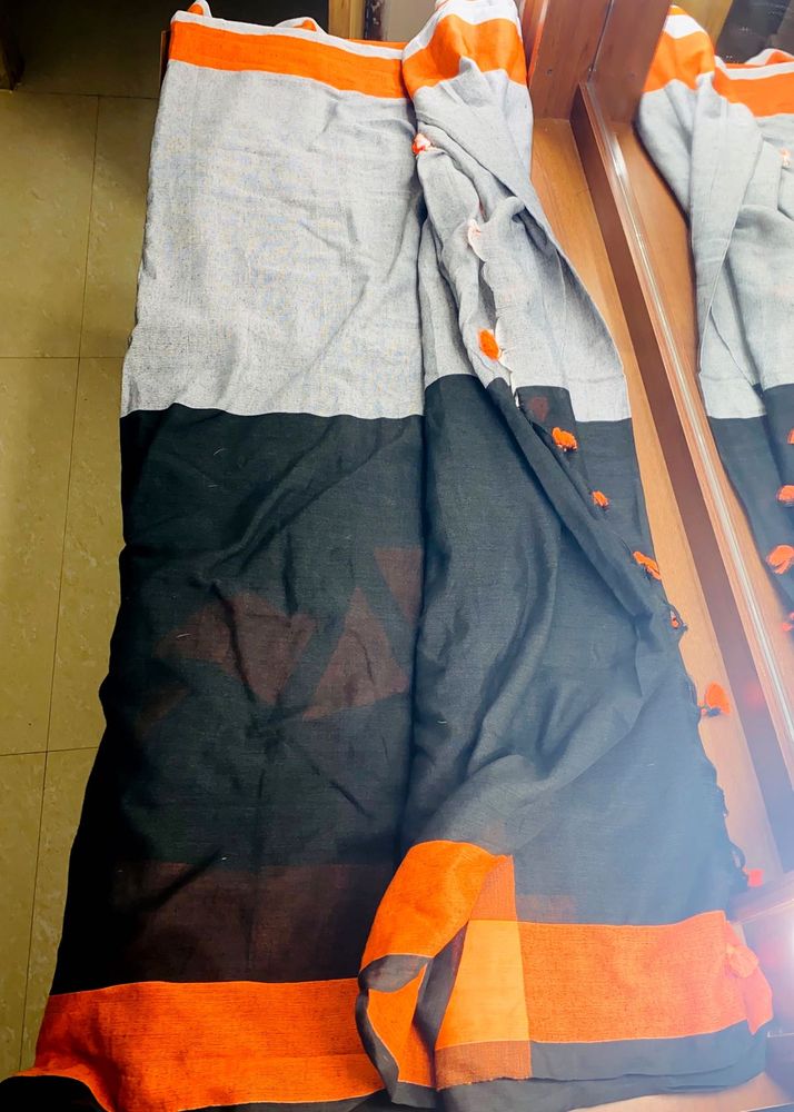 Black orange cotton blend saree with pompoms