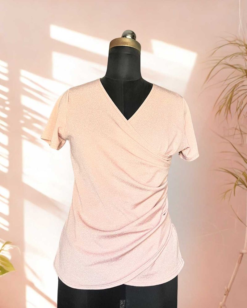 Pink shimmer top with ruching details on the waist