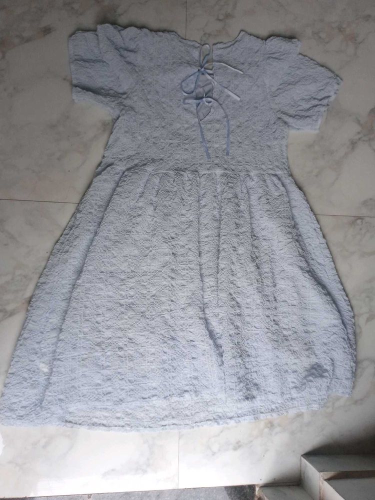 Light Blue Textured Dress With Bow Detailing