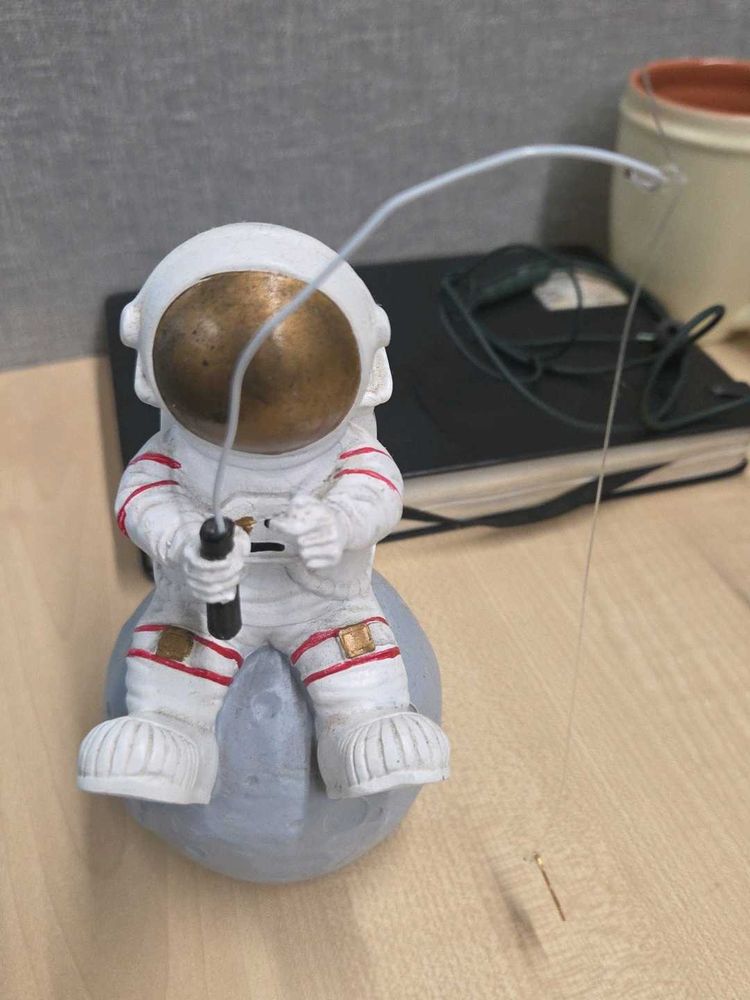 Astronaut Fishing on the Moon Figurine