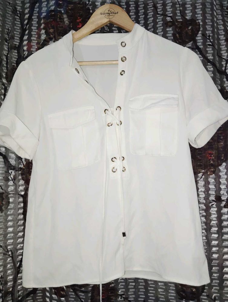womens..... top..... off wight color