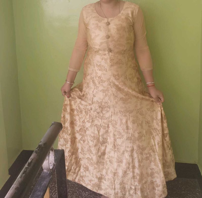 Nude Floral Gown With Cancan Styled Wit Stone Work