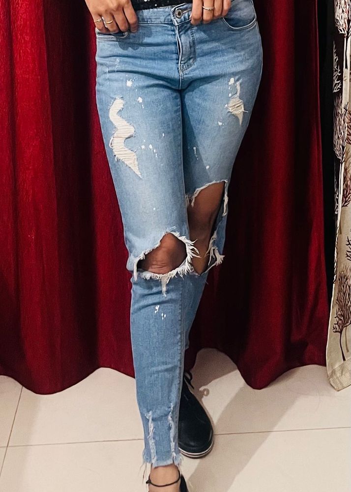 Ripped Knee Jeans