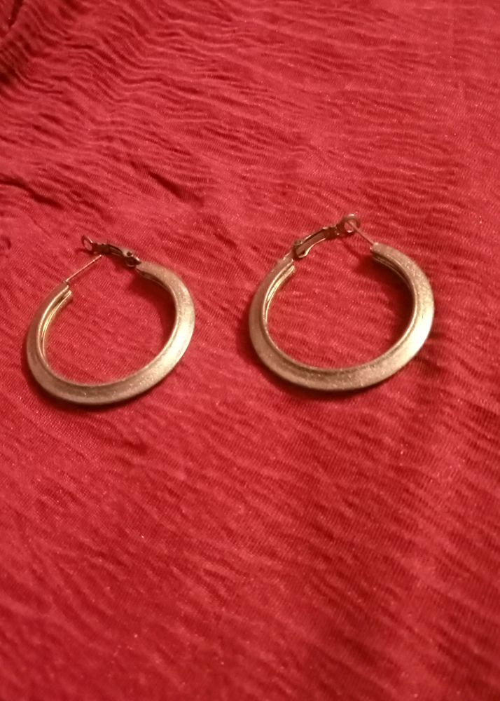 Gold decorative hoop Earrings.