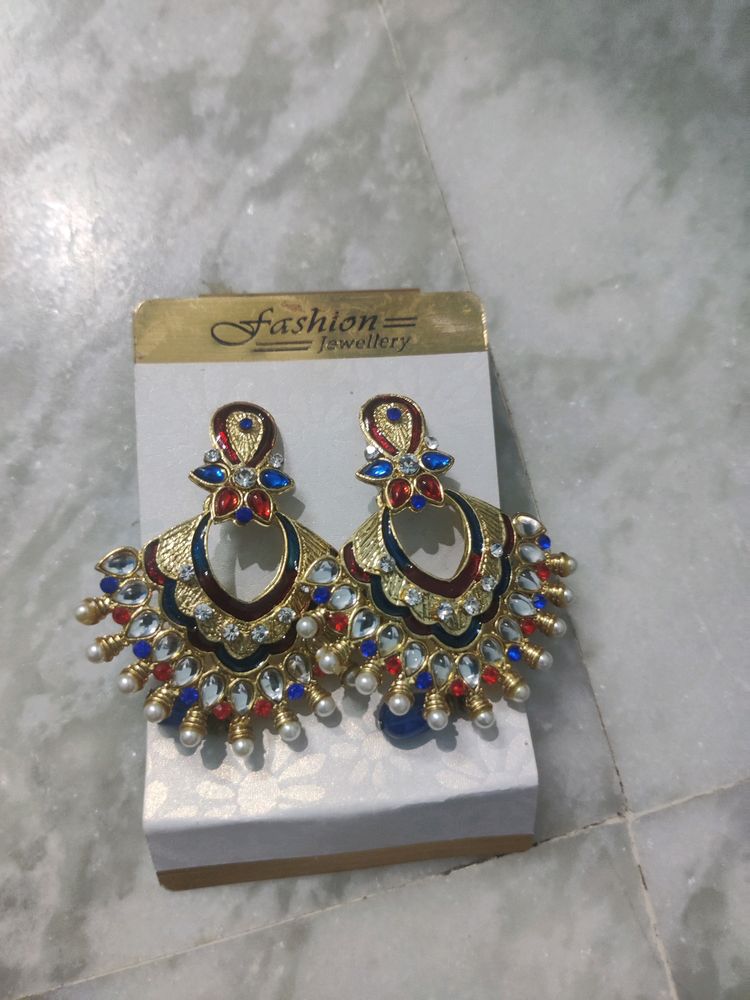 blue red stone on golden pleated earring