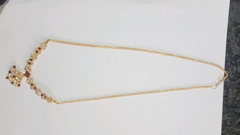Elegant Gold Necklace With Maroon Stone