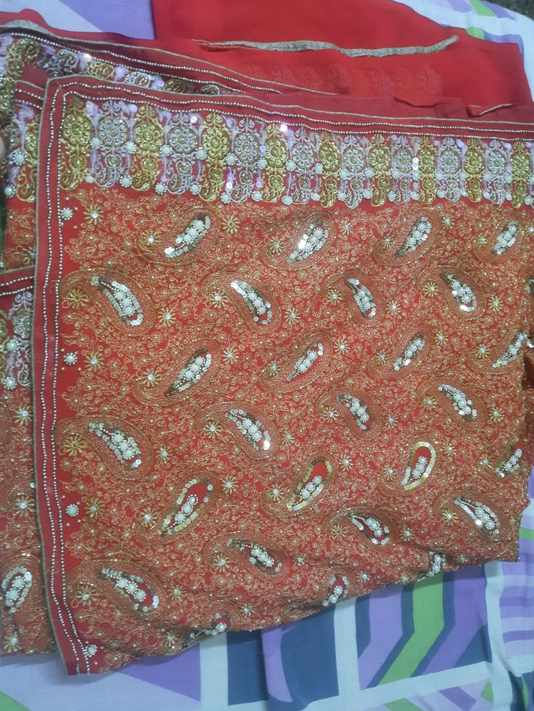 red saree for bride with heavy work