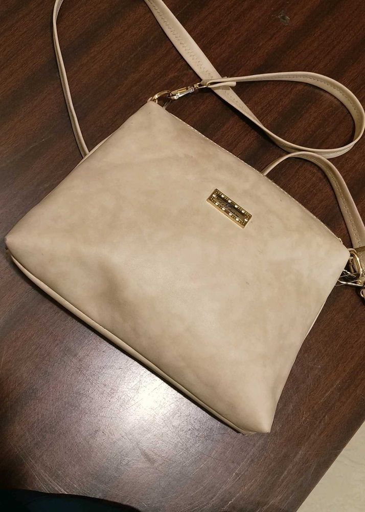 cream colour sling bag
