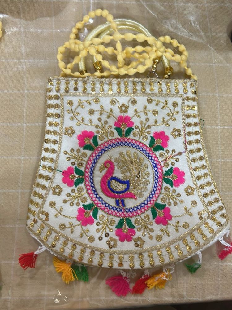 Embroidered Handbag with Peacock Design