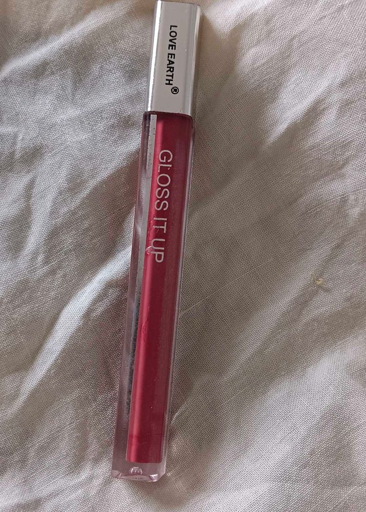 Love Earth Lip Gloss In The Shade Blow Up