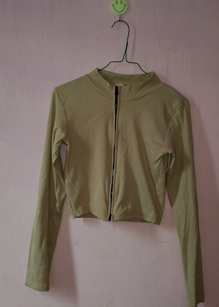 pastel green jacket top.