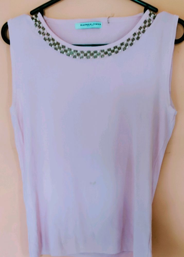 Pastel Pink Top. Bead work on the neck.  Small spo