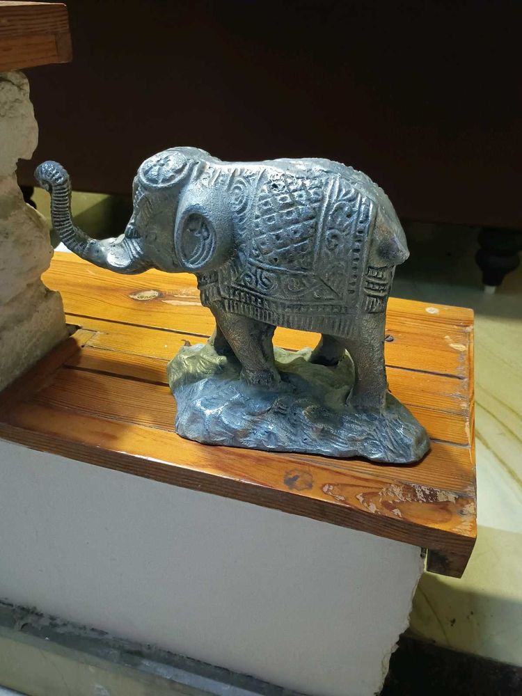 white metal elephant figurine.