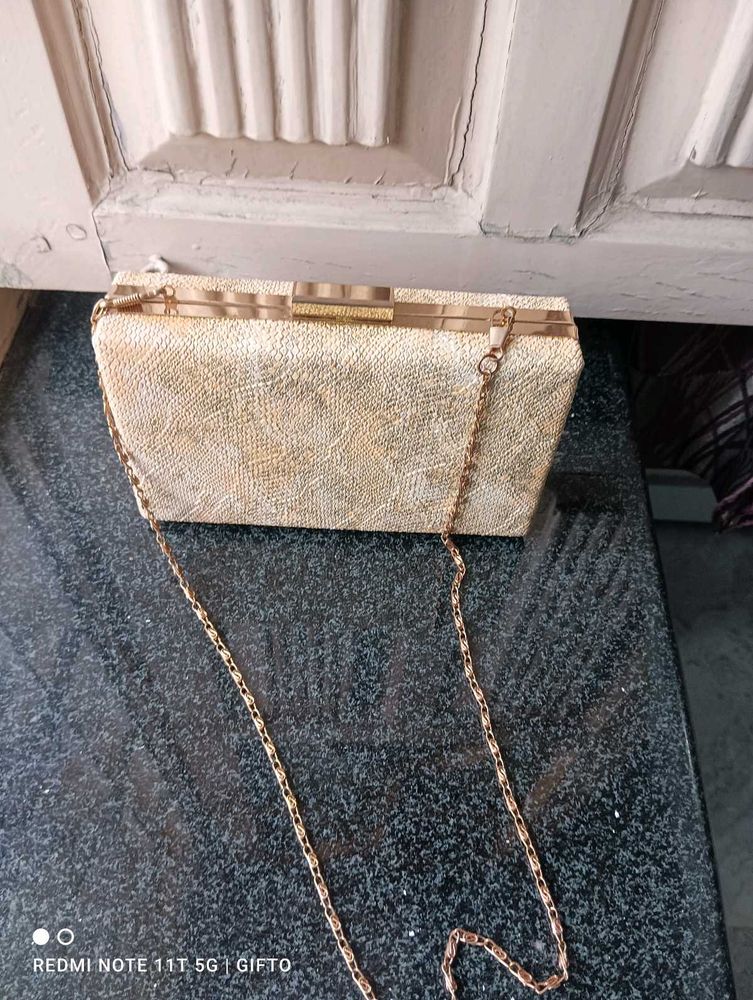 Party Wear Clutch. . Ligt Gold