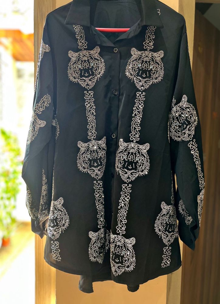 black oversized button-up shirt.