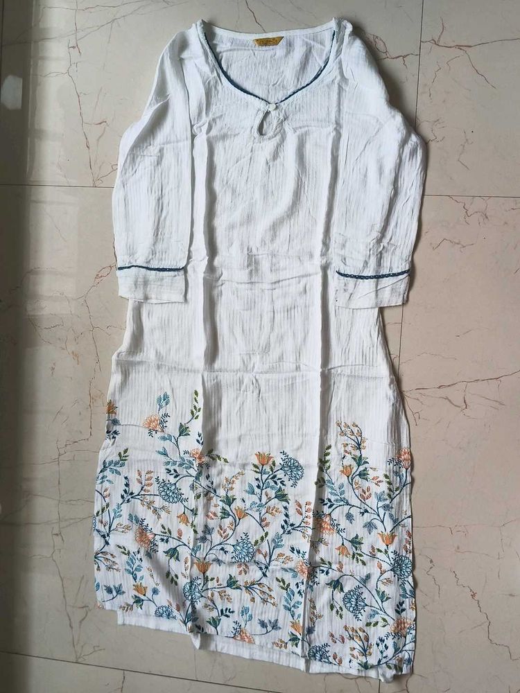 White kurta with beautiful floral work on it