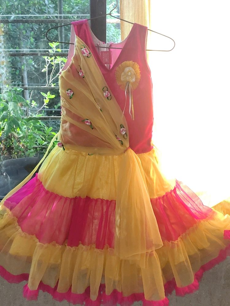 Girls Dress/Frock Yellow And Pink #under500.           It Has A Small But It's Not noticeable