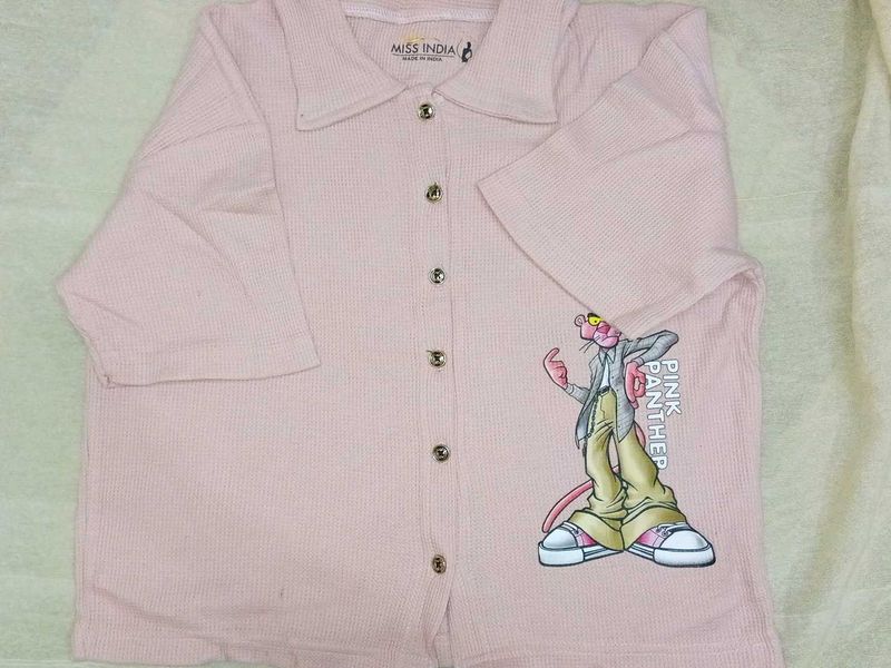 A beautiful peach coloured crop shirt