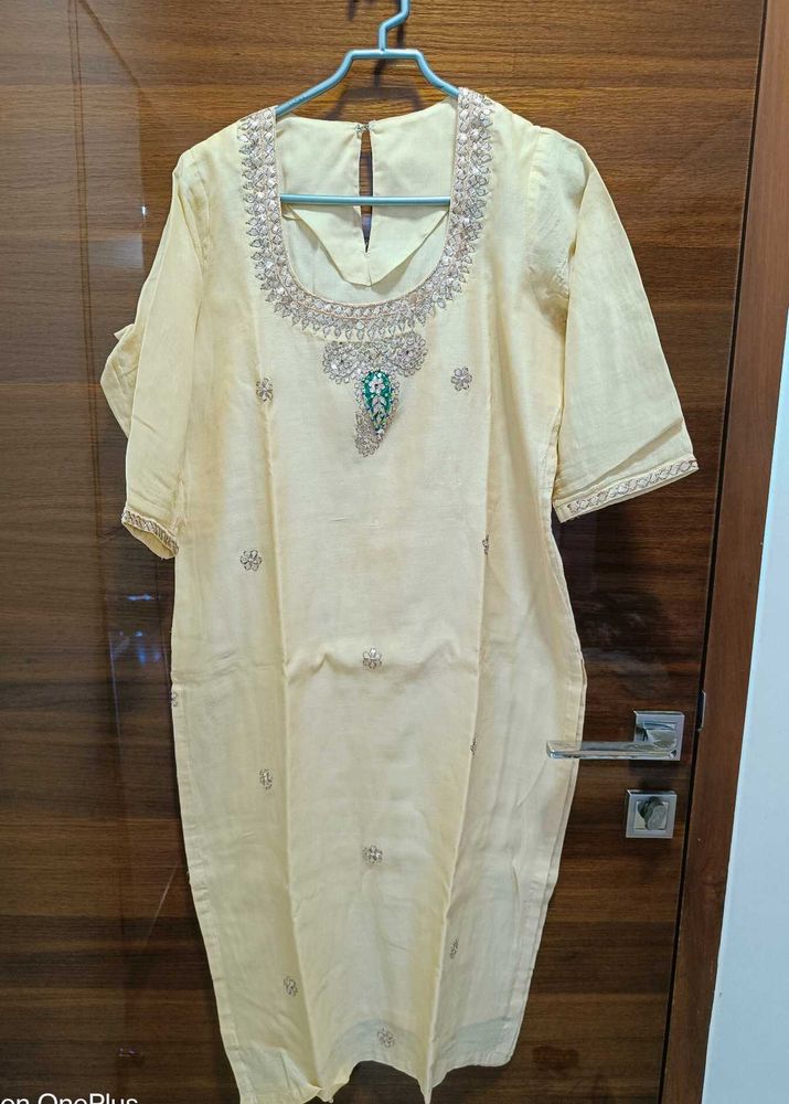 Beautiull cream kurti with neck work