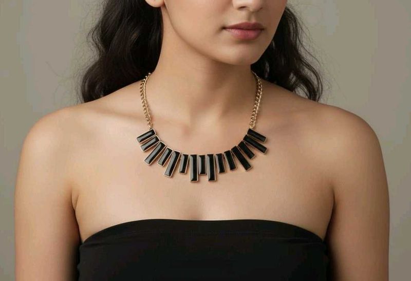 Black and gold neck piece