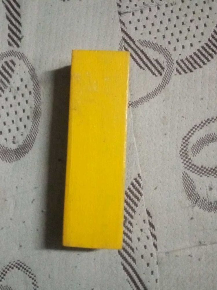 Yellow Wooden Block. Black board duster