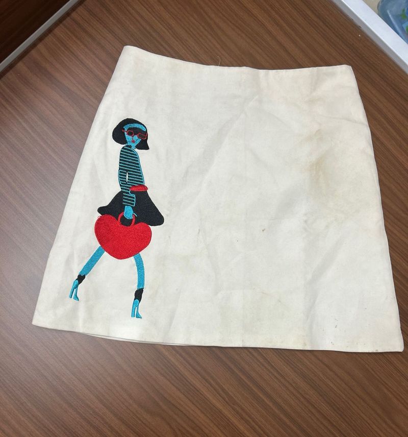 white skirt with a doll