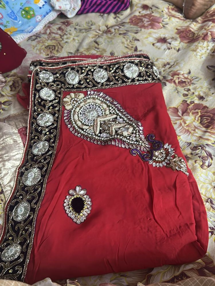 Red saree with embellishments