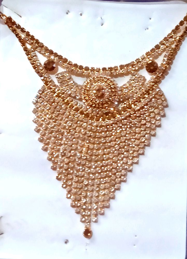 Golden Stone Necklace with ear rings and mangtika