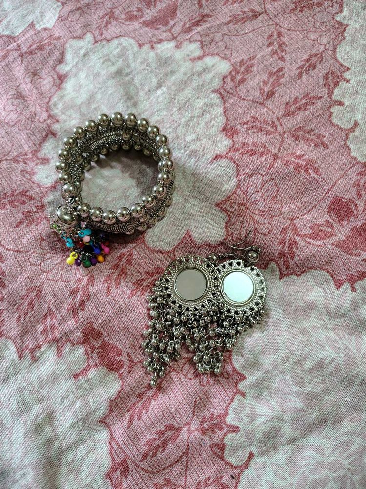 Silver tone bracelet and earrings