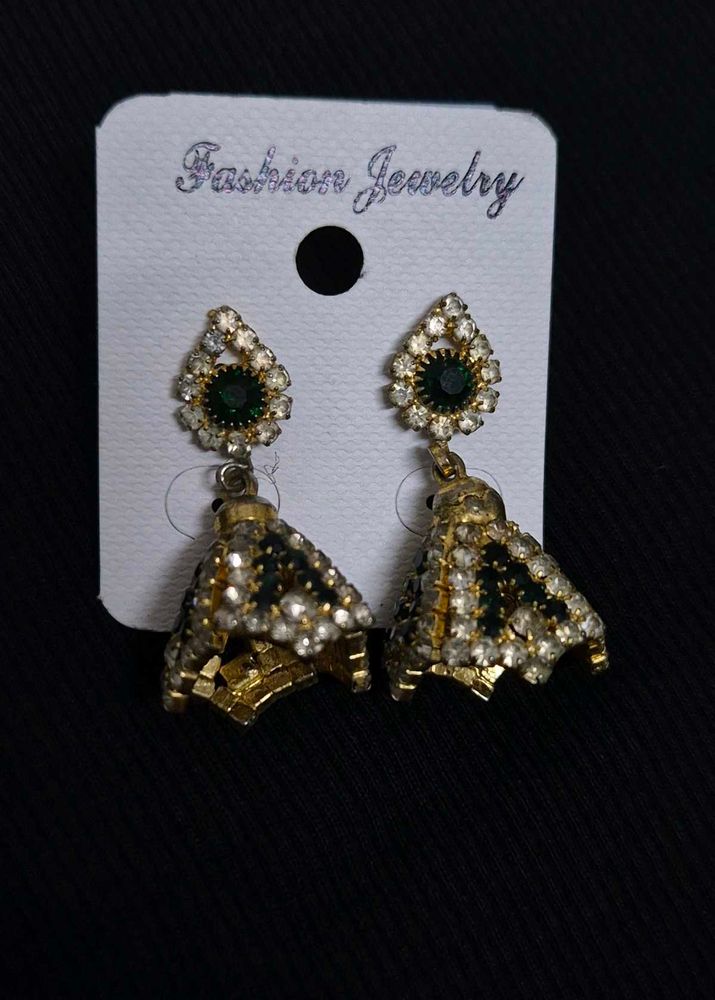 green emerald-toned earrings