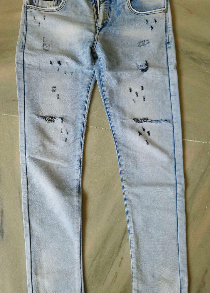 Distressed Light Wash Denim Jeans