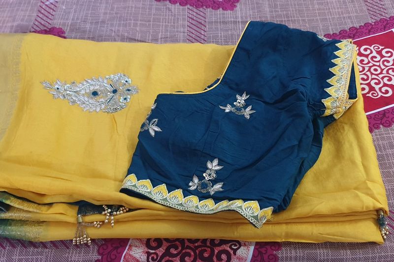 Elegent Yellow Saree With Tale Green Blouse