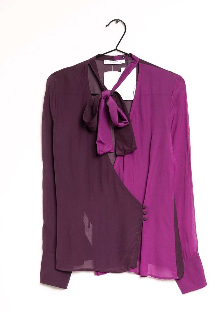 Branded two- tone wrap top.