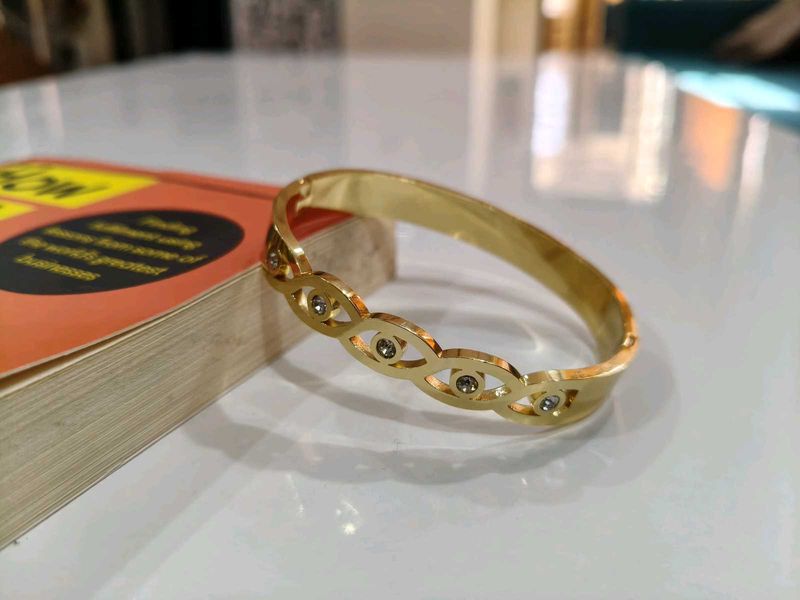 Gold Tone Bangle Bracelet with Accents