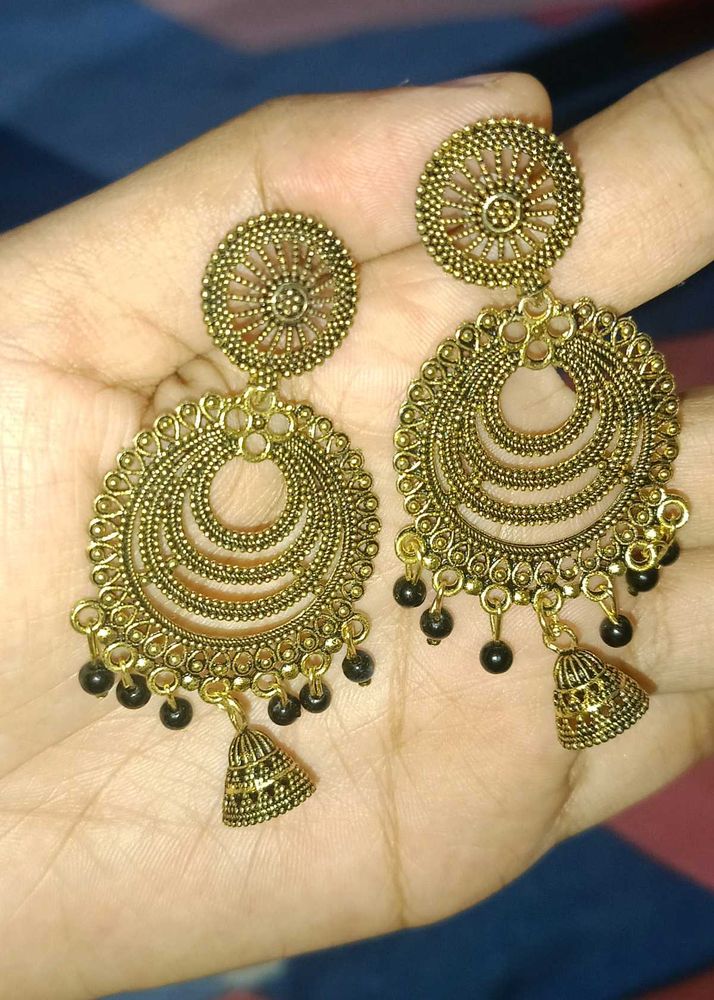 A Pair Of Traditional Style Earrings