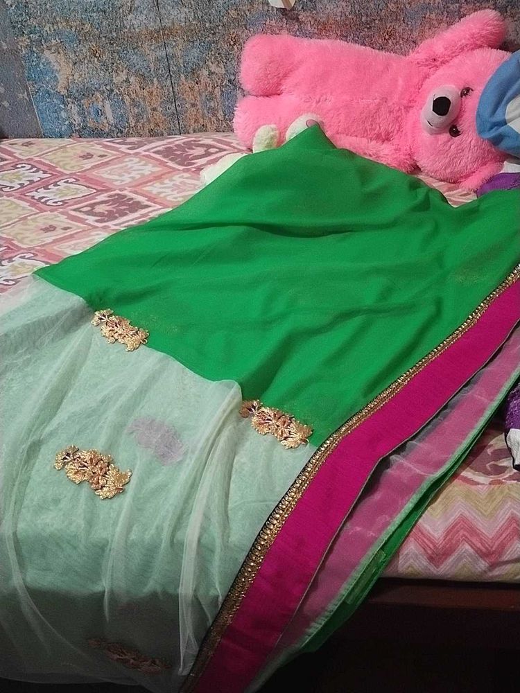 Saree half green and white combination.