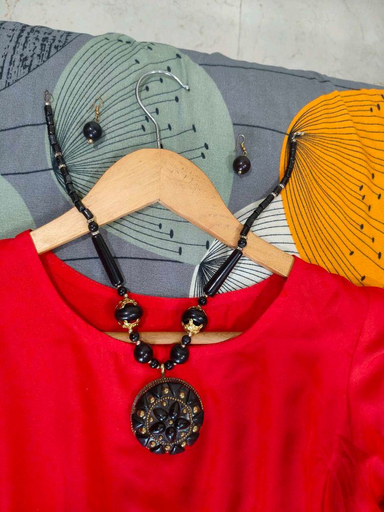 Red Frock With Black Accessories