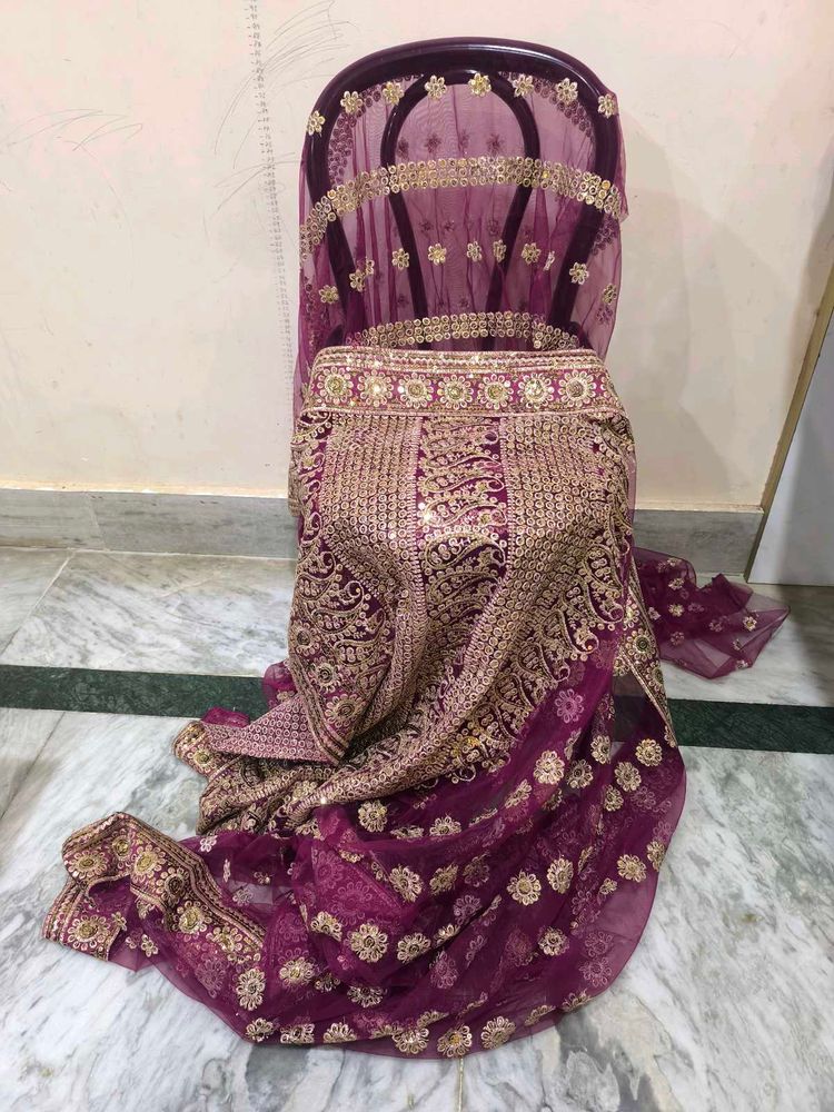 Purple Net Heavy Work Saree With Shiny Petticoat.