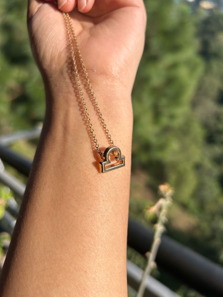 golden libra sign chain