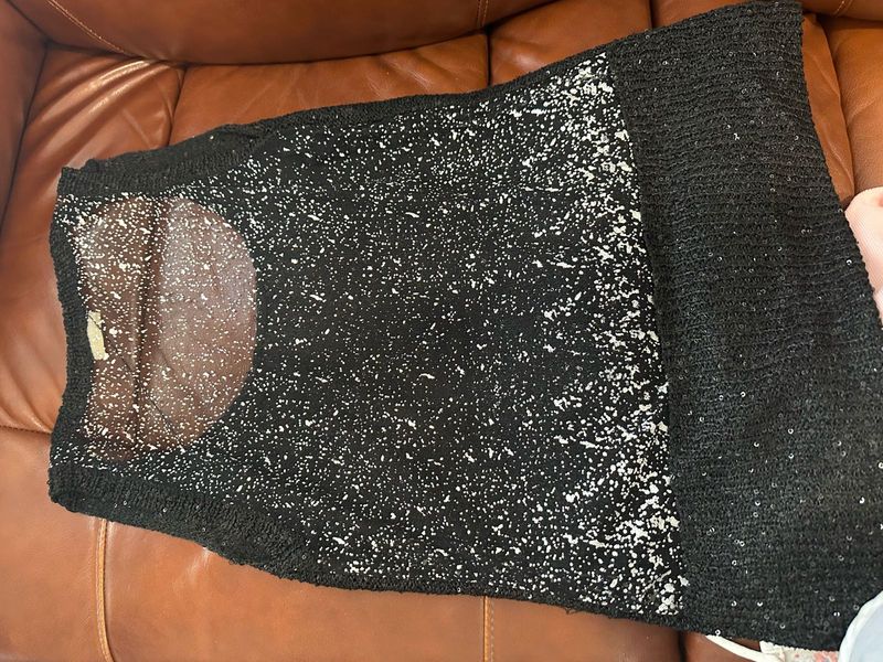 A Black Sequin Top With Net Back