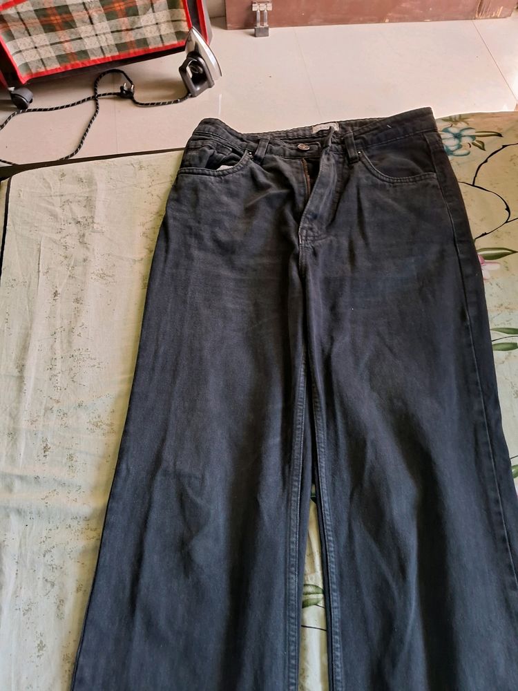 A Mixture Of Greyish Balckish Jeans