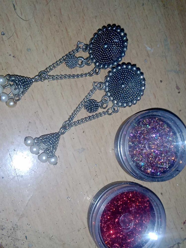 Elegant Jhumka Earrings and nail glitter