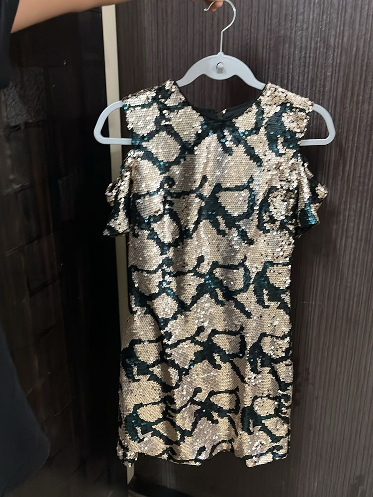 Embellished bodycon cold shoulder dress.