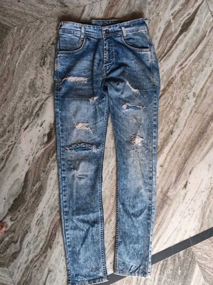 Ripped Blue Denim Jeans