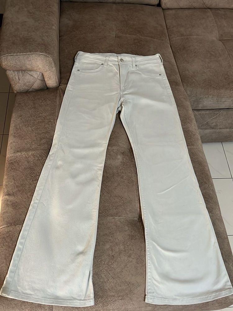Cream bootcut Jeans