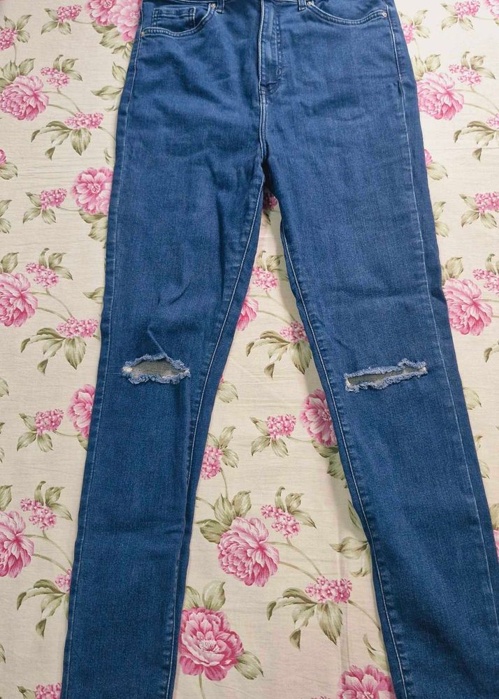 Ripped Knee Jeans
