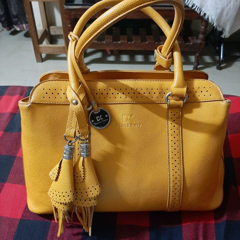 Diana Korr mustard coloured bag