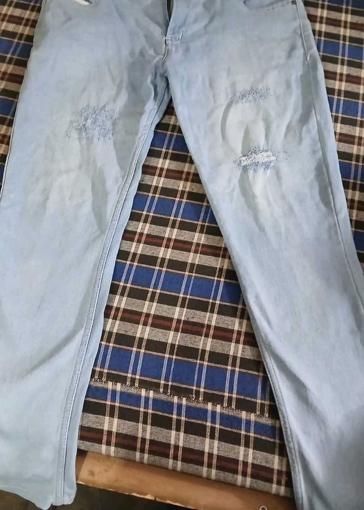 Ripped Light Wash Denim Jeans