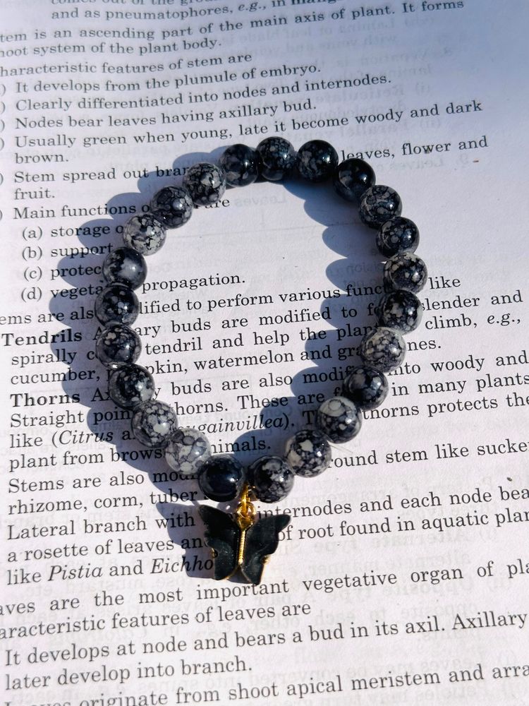 Black Printed Beads Bracelet With Hanging Charm.